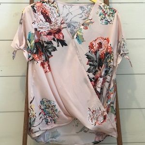 Loose v neck blouse with blooms.